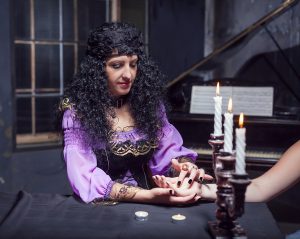 Sorceress reading somebody's hand